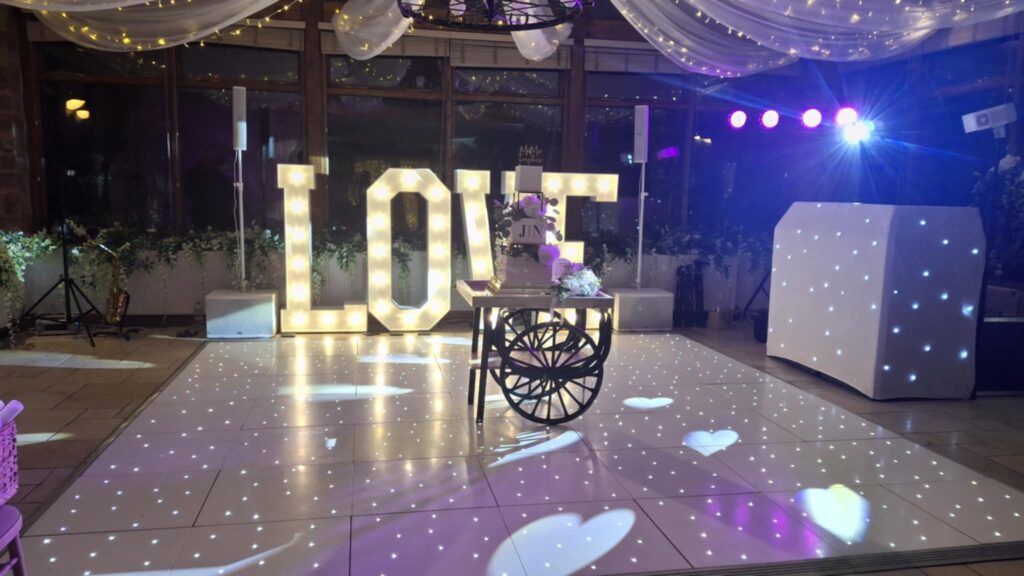 wedding DJ set up with dance floor & LOVE letters